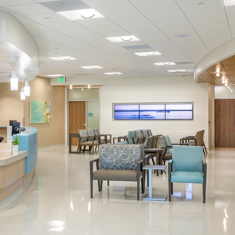 reception area desk, chairs and televisions